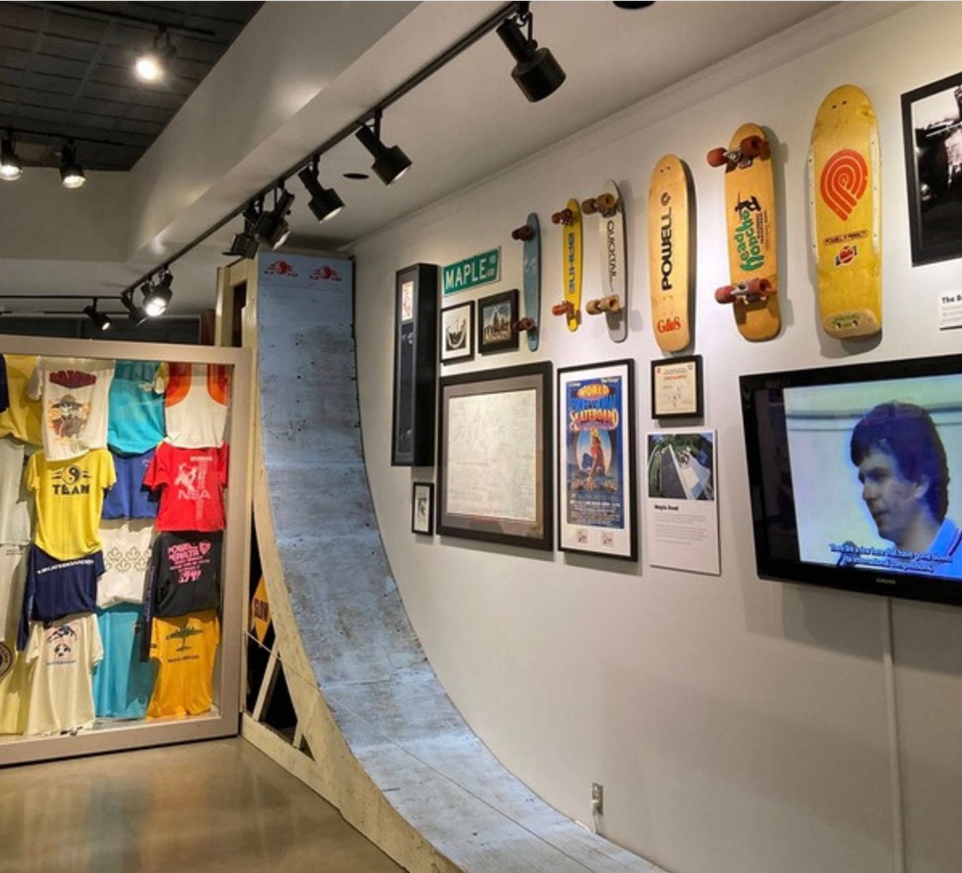 A to-scale replica of the Maple Road half-pipe with vintage decks, T-shirts and a video screen along the wall